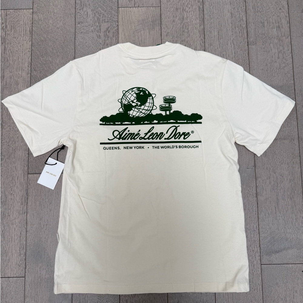 Aime Leon Dore Off-White Tee with Dark Green Graphic